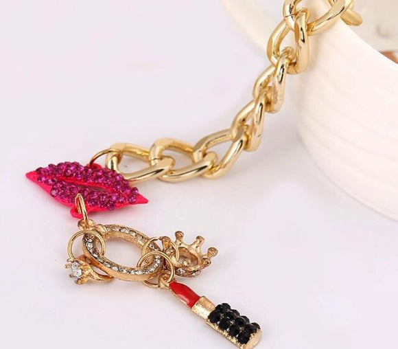 Bracelet with lip/lipstick charms