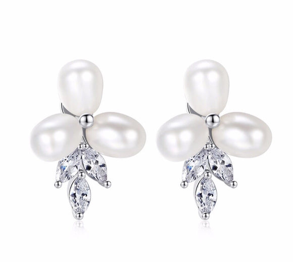 Three pearl earrings
