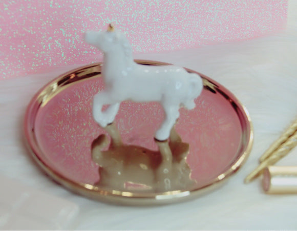 White unicorn on a gold tray